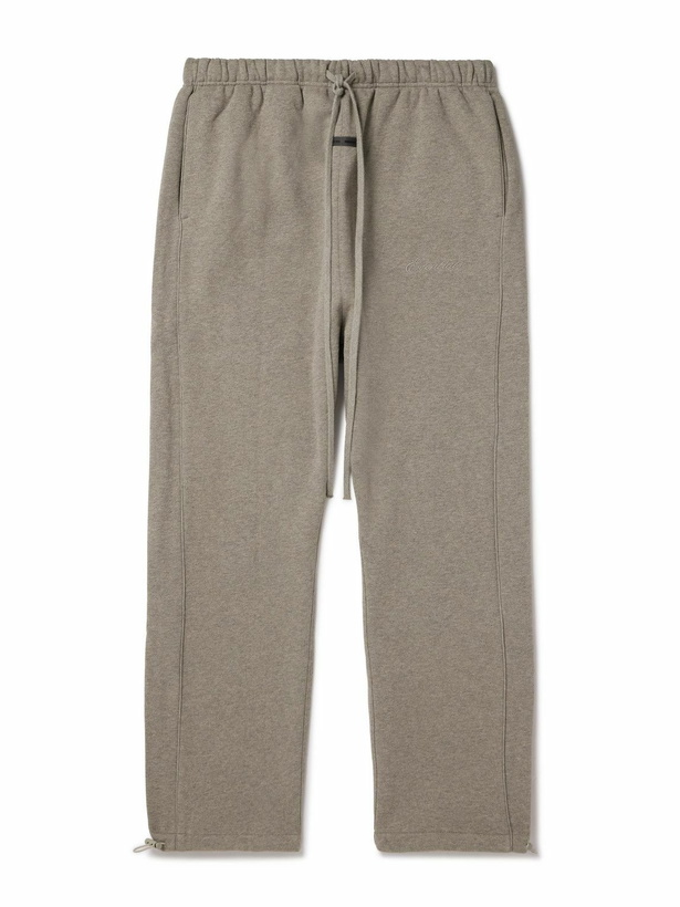 Photo: FEAR OF GOD ESSENTIALS - Tapered Logo-Appliquéd Cotton-Blend Jersey Sweatpants - Brown