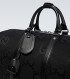 Gucci - Jumbo GG leather-trimmed travel bag