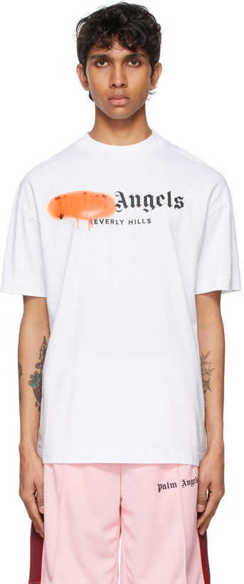 Photo: Palm Angels White & Orange Sprayed Logo 'Beverly Hills' T-Shirt