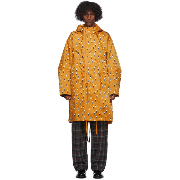Photo: Undercover Orange Printed Rain Coat