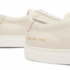 Woman by Common Projects Women's Nubuck Leather Achilles Trainers Sneakers in Off White