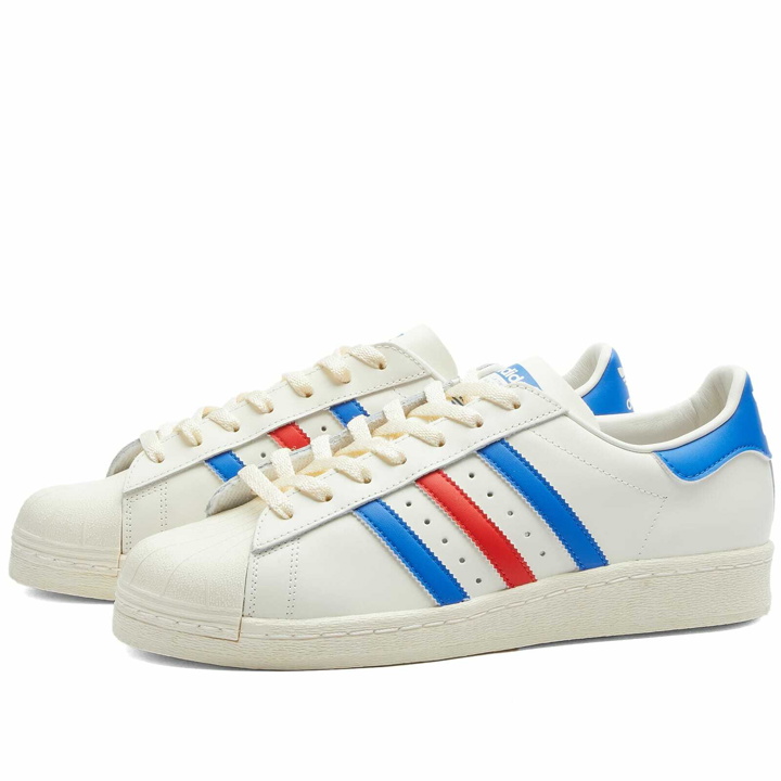 Photo: Adidas Men's Superstar 82 Sneakers in Cloud White/Blue Dawn