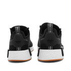 Adidas Men's NMD_R1 Primeblue Sneakers in Core Black/Gum
