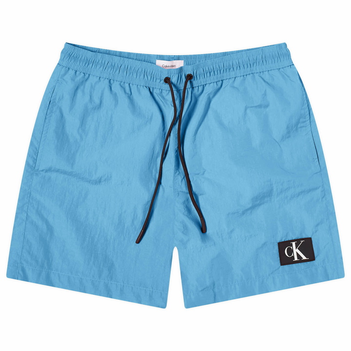 Photo: Calvin Klein Men's Monogram Logo Nylon Swim Shorts in Blue