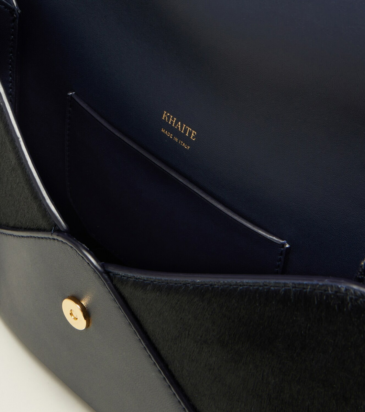 Khaite Grace leather-trimmed suede clutch