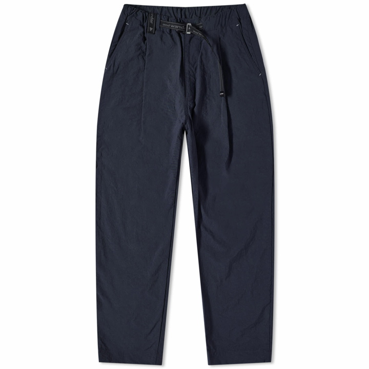 Photo: And Wander Men's Chino Tuck Tapered Pants in Navy