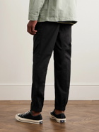 Incotex - Tapered Pleated Stretch-Cotton Gabardine Trousers - Black