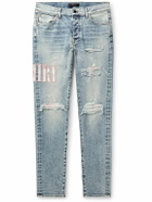 AMIRI - Skinny-Fit Logo-Appliquéd Distressed Jeans - Blue