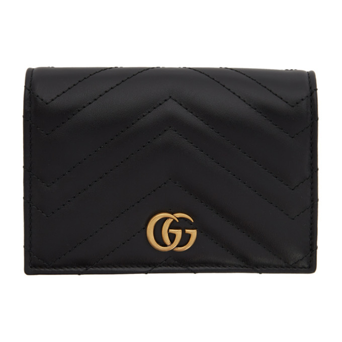 GG Embossed Passport Holder in Black - Gucci