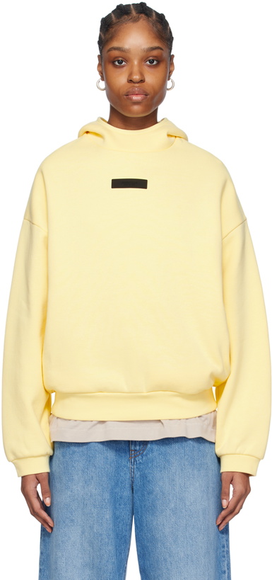 Photo: Fear of God ESSENTIALS Yellow Pullover Hoodie