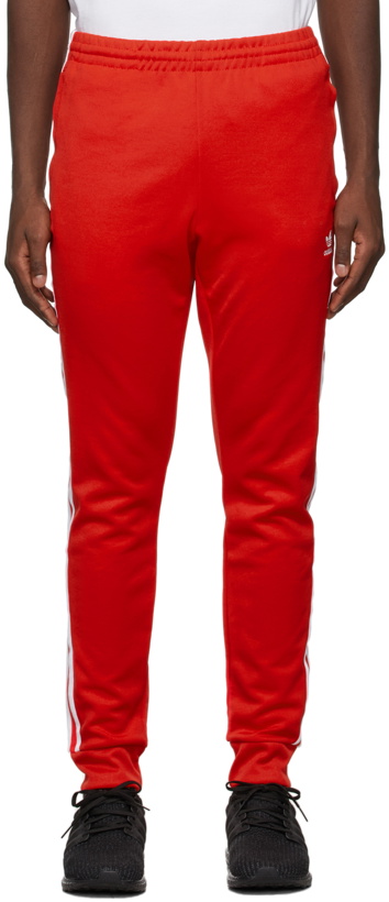 Photo: adidas Originals Red Adicolor Classics Primeblue SST Track Pants