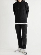 C.P. COMPANY - Logo-Appliquéd Garment-Dyed Cotton-Blend Trousers - Black - IT 48