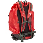 The North Face Men's x Undercover Soukuu Backpack in Dark Cedar Green/High Risk Red