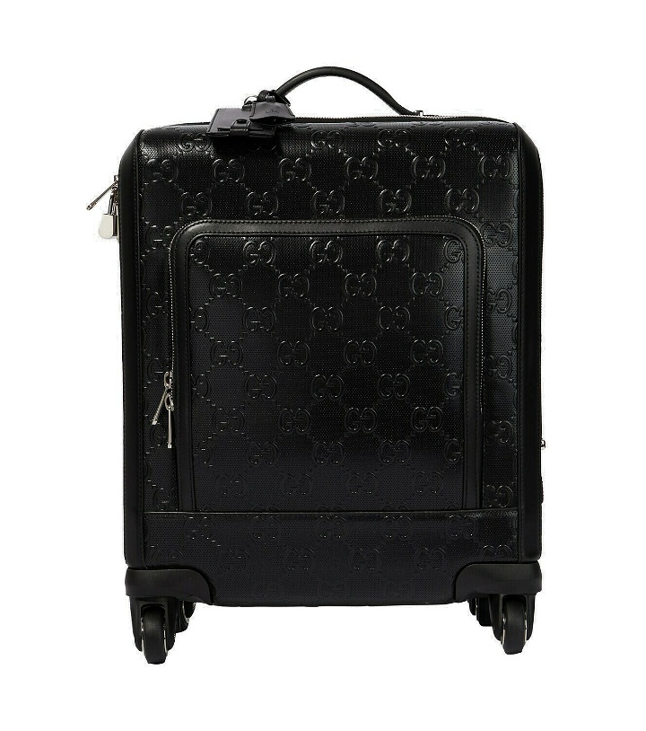 Photo: Gucci - GG Small embossed carry-on suitcase