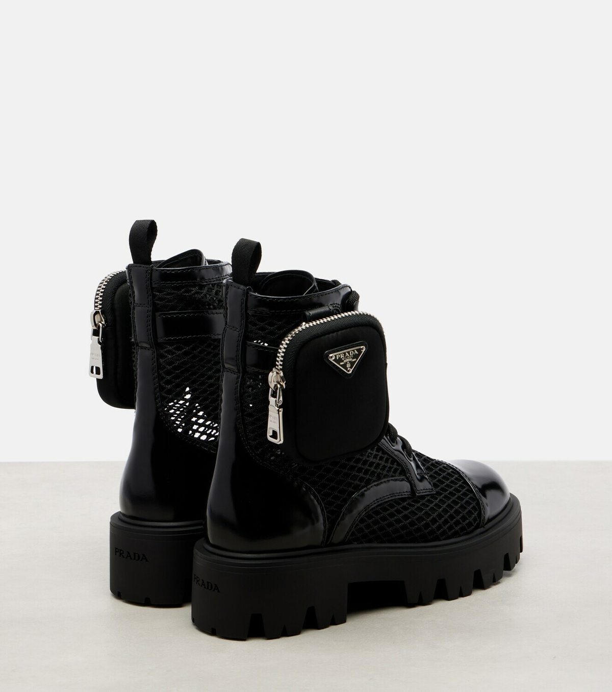 Prada Leather-trimmed mesh combat boots