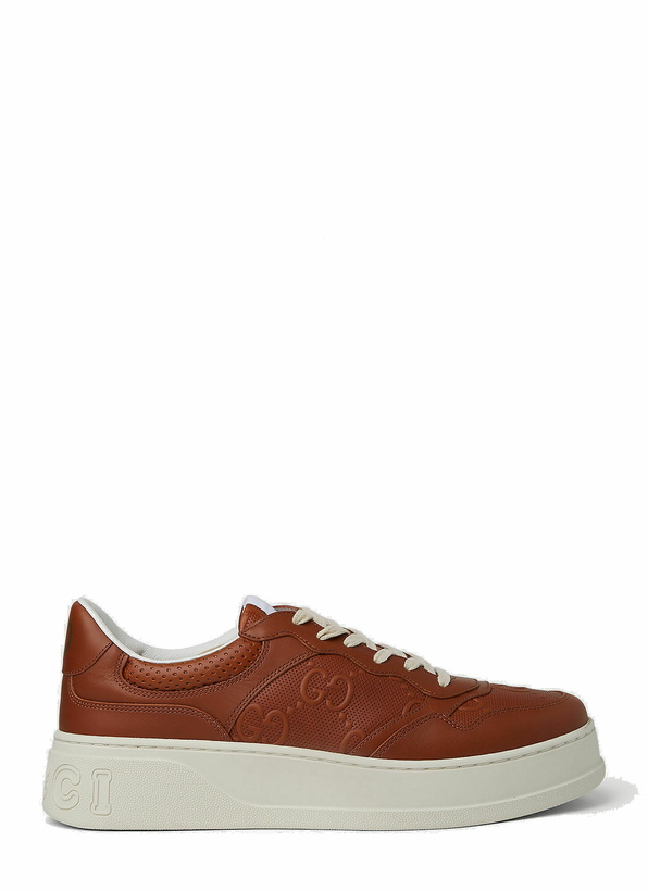 Photo: GG Embossed Basket Sneakers in Brown