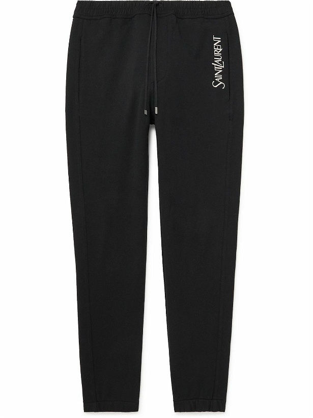 Photo: SAINT LAURENT - Tapered Logo-Embroidered Cotton-Jersey Sweatpants - Black