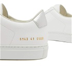 Woman by Common Projects Women's Retro Classic Trainers Sneakers in White/Silver