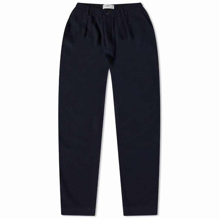 Photo: Universal Works Men's Soft Wool Pleated Track Pant in Navy