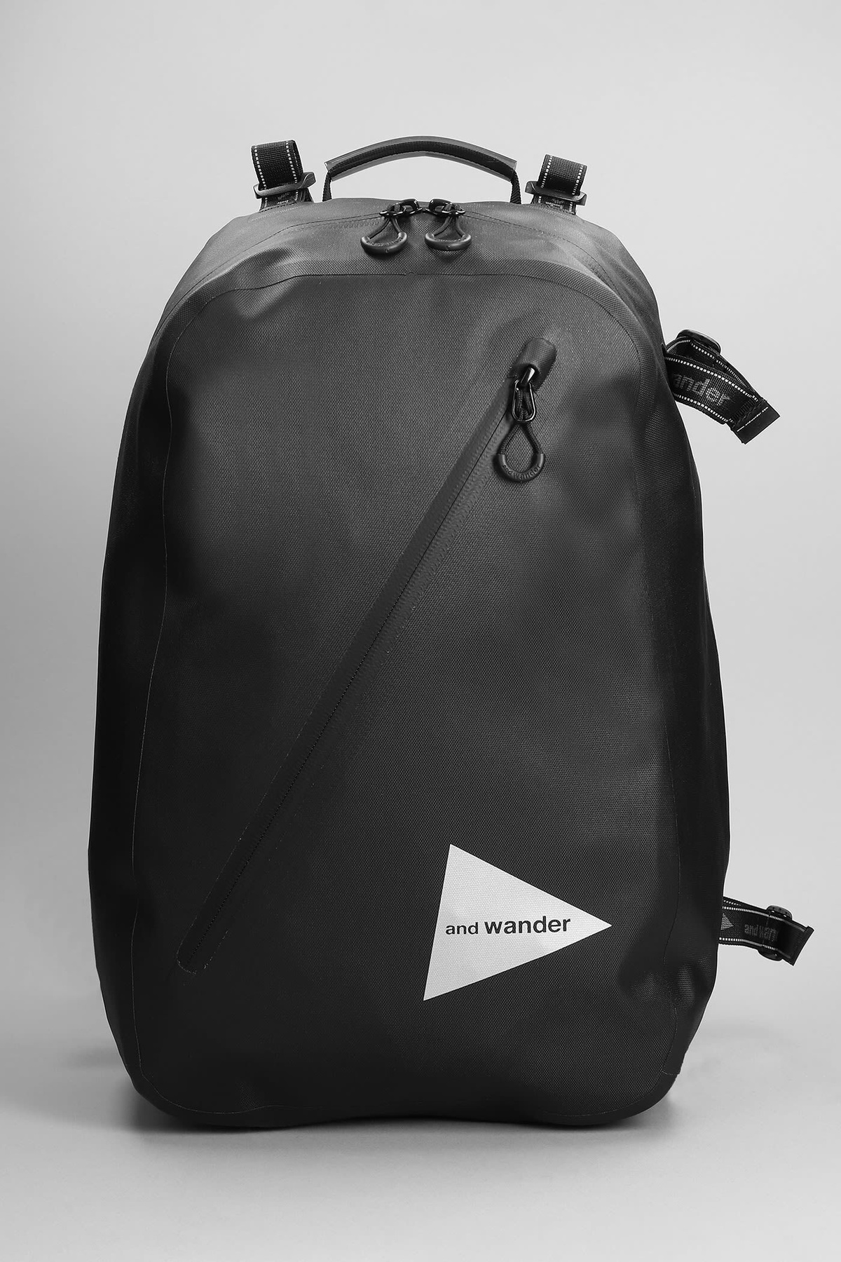 And Wander Backpack In Black Nylon and Wander