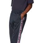 Champion Reverse Weave Navy Jacquard Logo Tape Popper Track Pants