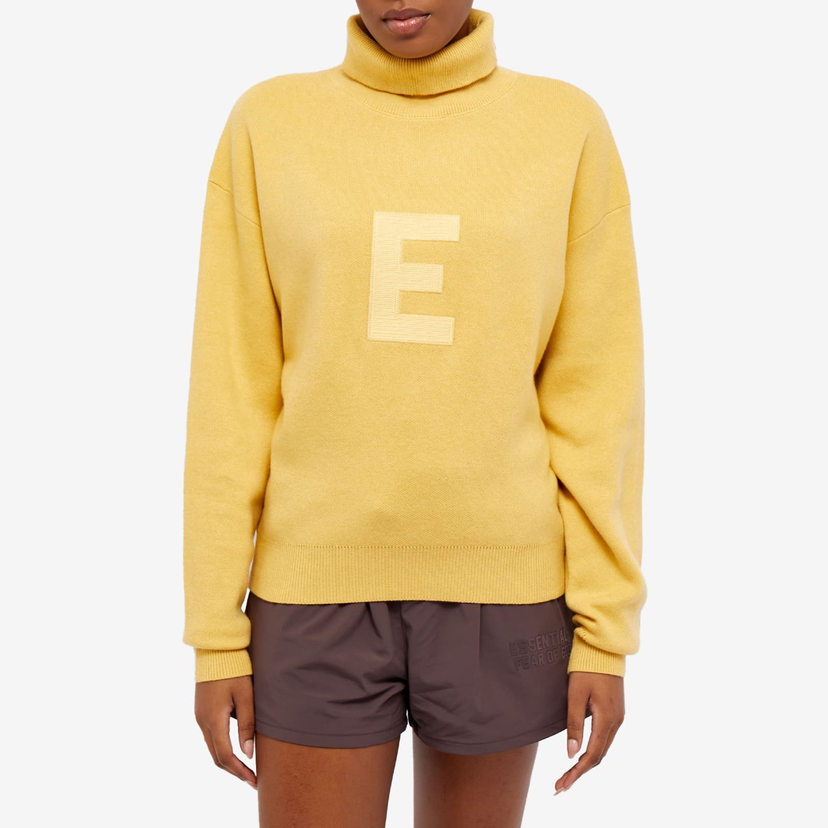 Fear of God ESSENTIALS Women s Turtleneck in Light Tuscan Fear Of