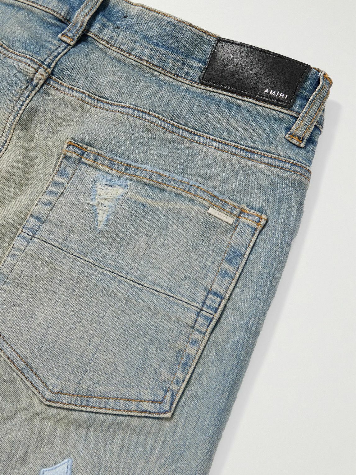 AMIRI - Slim-Fit Straight-Leg Logo-Appliquéd Panelled Distressed Jeans - Blue