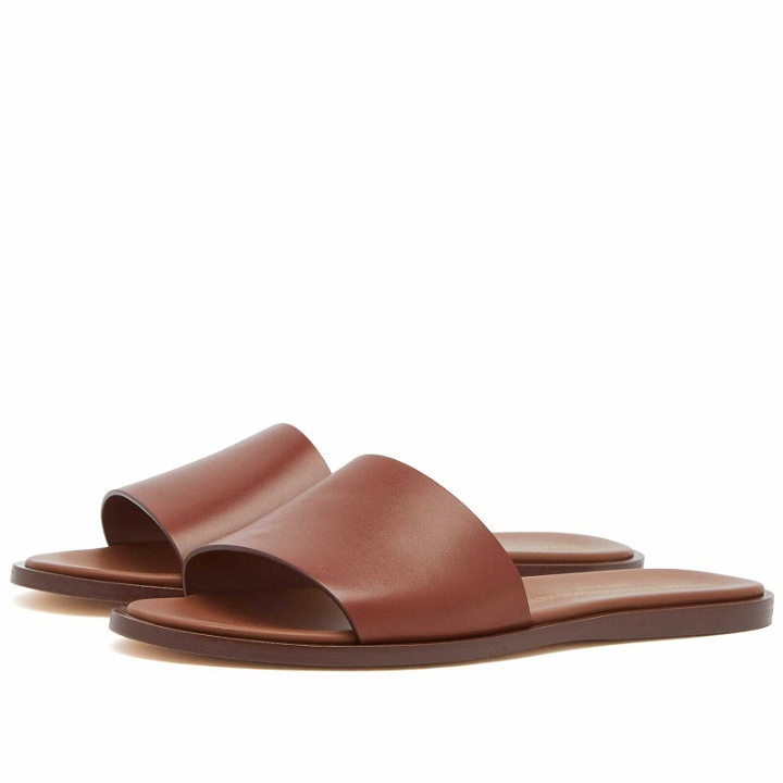 Photo: Woman by Common Projects Women's Leather Slides in Brown