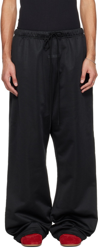 Photo: Fear of God ESSENTIALS Black Holiday Satin Fleece Lounge Sweatpants