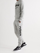 ALEXANDER MCQUEEN - Tapered Logo-Print Mélange Loopback Cotton-Jersey Sweatpants - Gray
