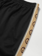 GUCCI - Tapered Logo-Jacquard Webbing-Trimmed Tech-Jersey Track Pants - Black