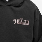 Sporty & Rich Men's SR Health Resort Hoodie in Black/Salmon