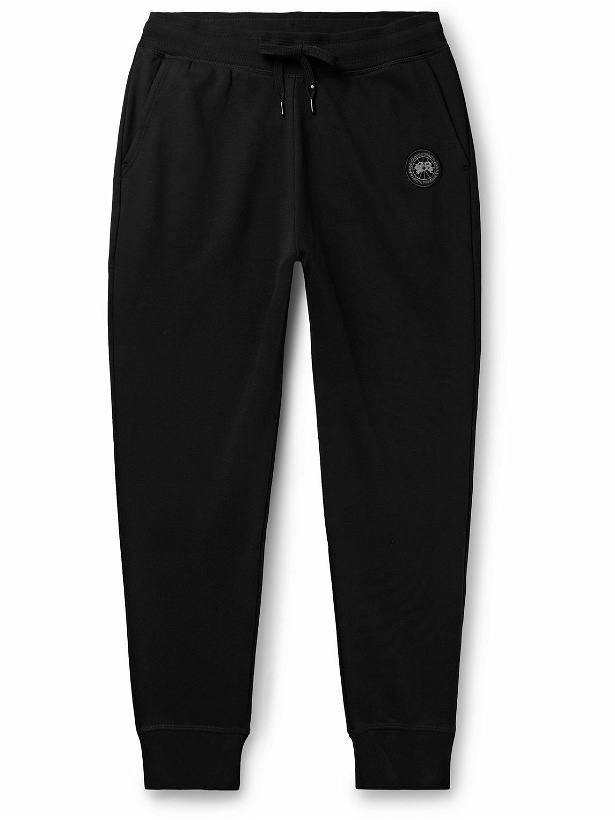 Photo: Canada Goose - Black Label Huron Tapered Logo-Appliquéd Cotton-Jersey Sweatpants - Black