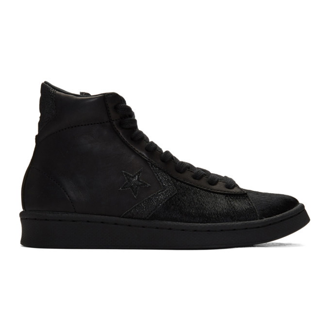 Photo: Converse Black Pro Leather Mid Sneakers