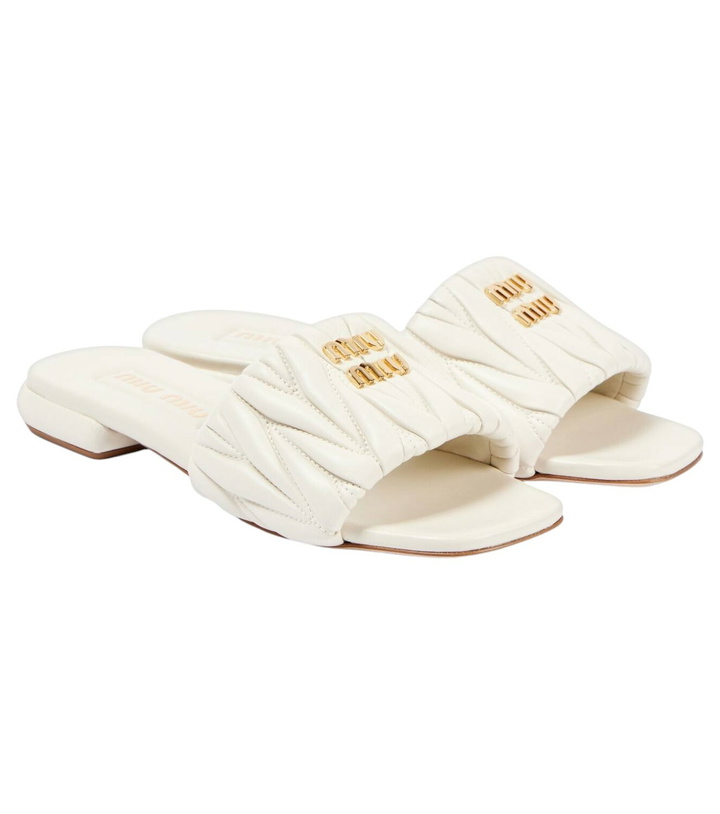 Photo: Miu Miu Logo matelassé leather slides