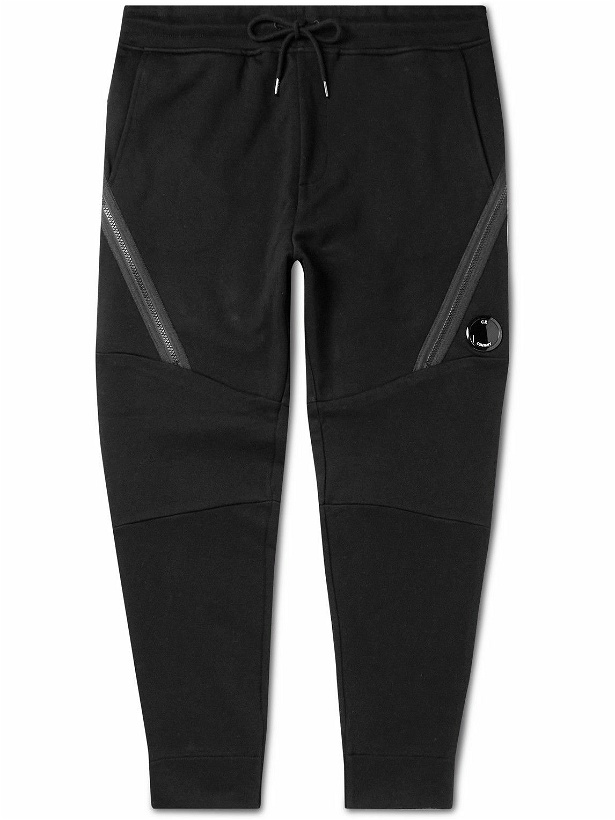 Photo: C.P. Company - Tapered Panelled Logo-Appliquéd Cotton-Jersey Sweatpants - Black