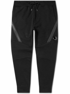 C.P. Company - Tapered Panelled Logo-Appliquéd Cotton-Jersey Sweatpants - Black