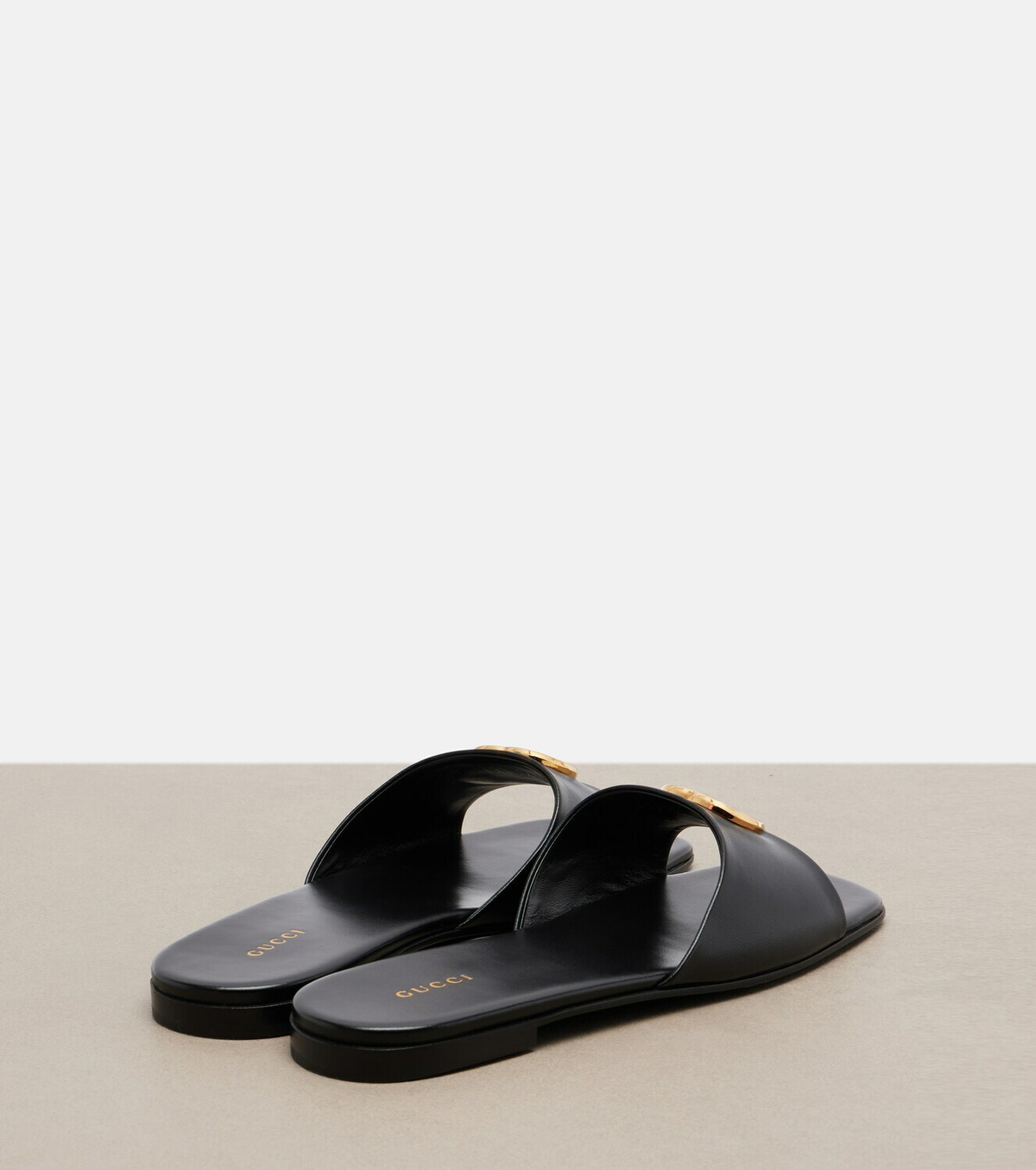 Gucci Double G leather slides