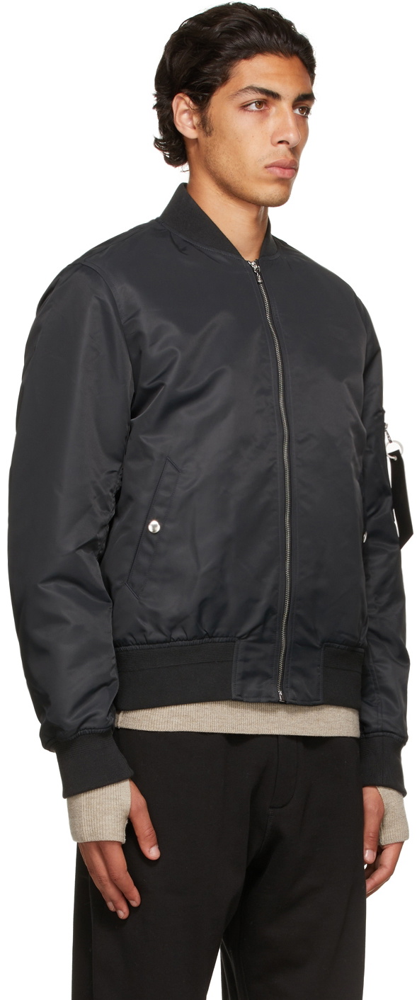 https://cdn.clothbase.com/uploads/a67dff33-2a69-4445-b773-dfee0e8a4891/black-recycled-nylon-manston-bomber-jacket.jpg