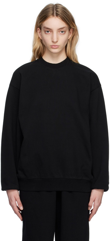 Photo: SKIMS Black SKIMS Boyfriend Fleece Crew Neck Sweatshirt