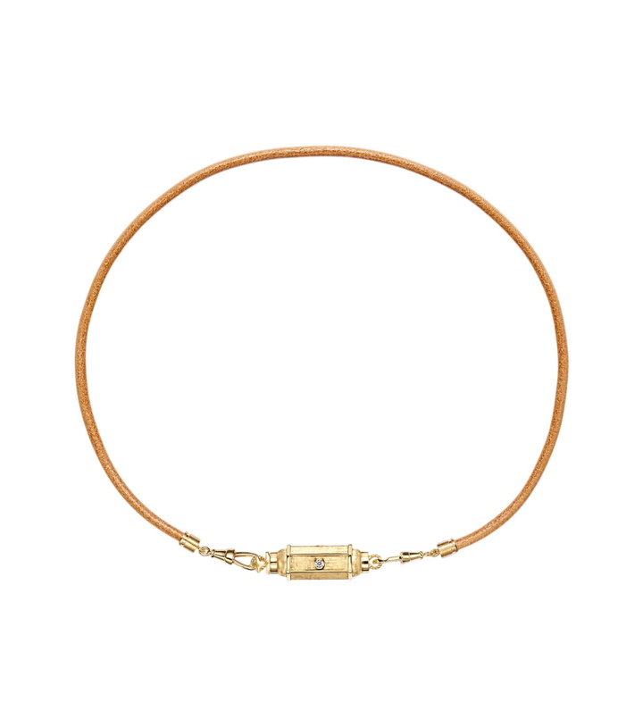 Photo: Marie Lichtenberg 18kt gold and leather pendant necklace with diamonds