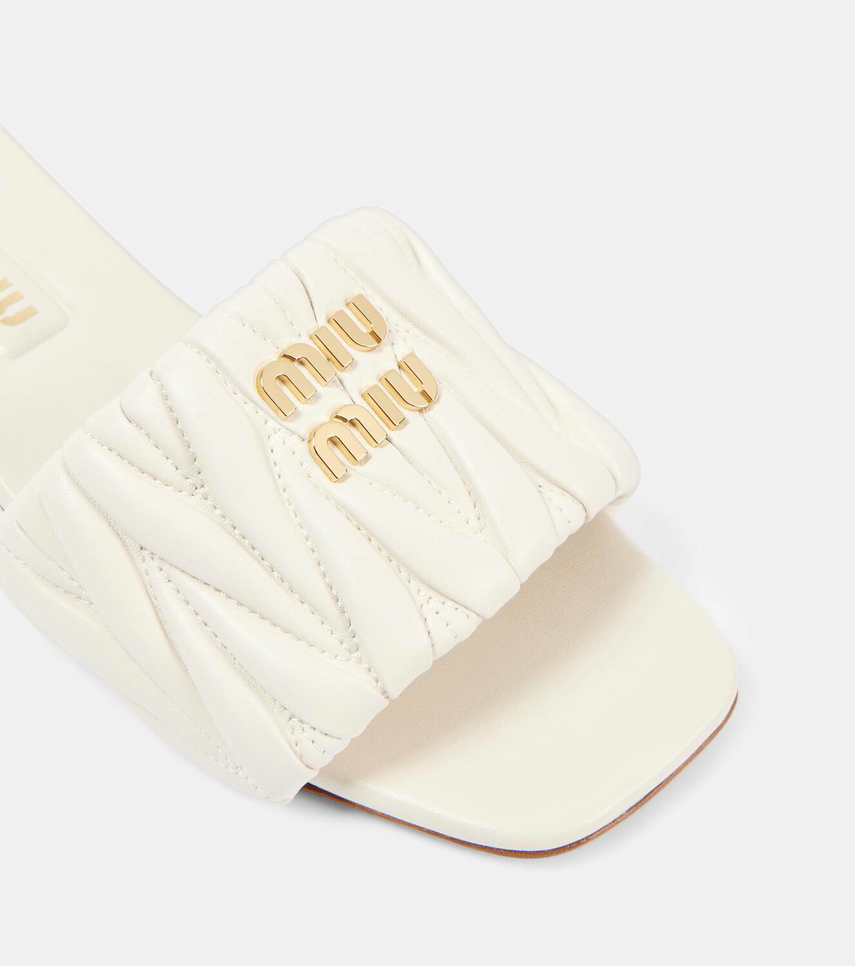 Miu Miu Logo matelassé leather slides Miu Miu