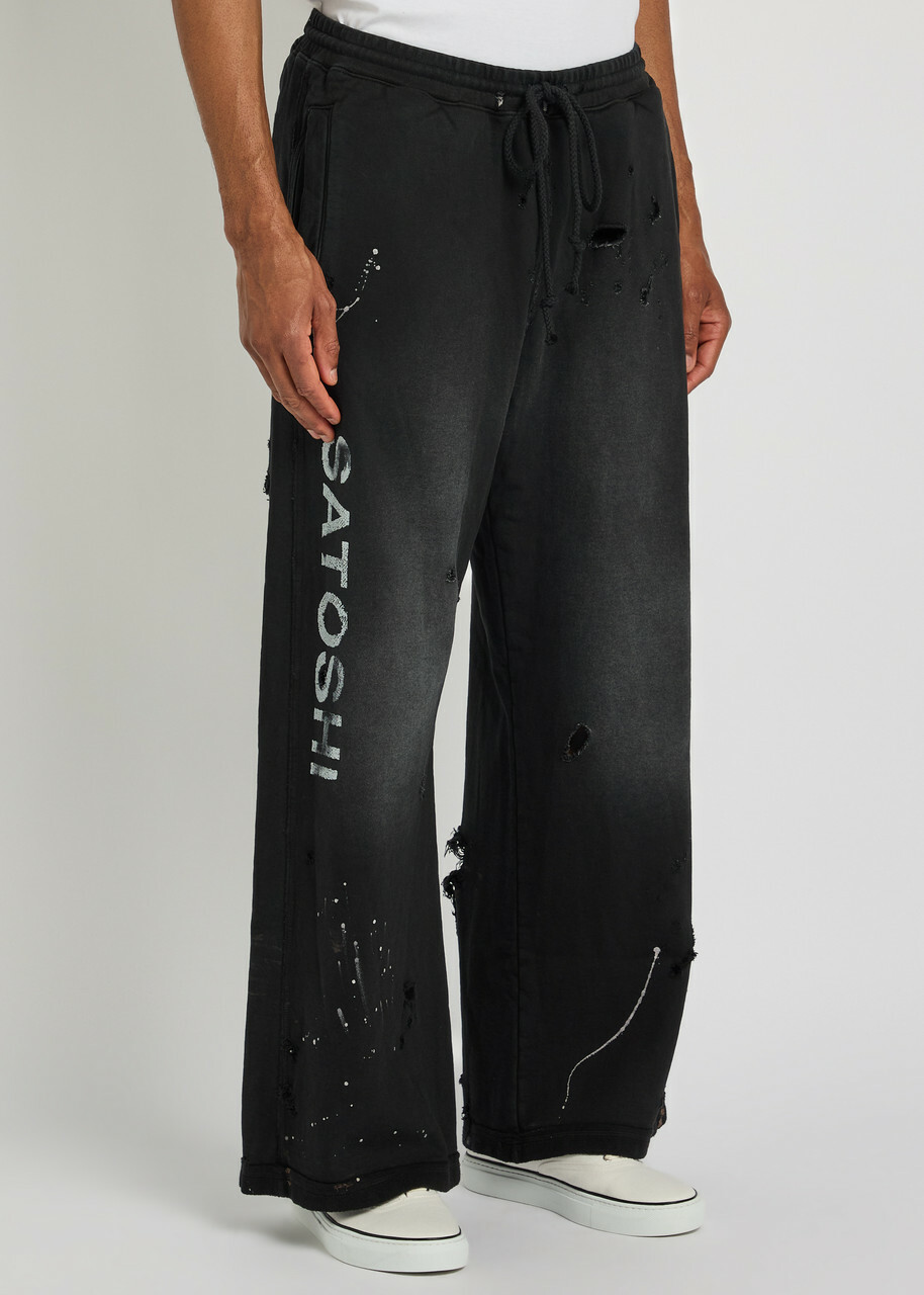 Satoshi Nakamoto Luke Printed Distressed Wide-leg Cotton Sweatpants Black
