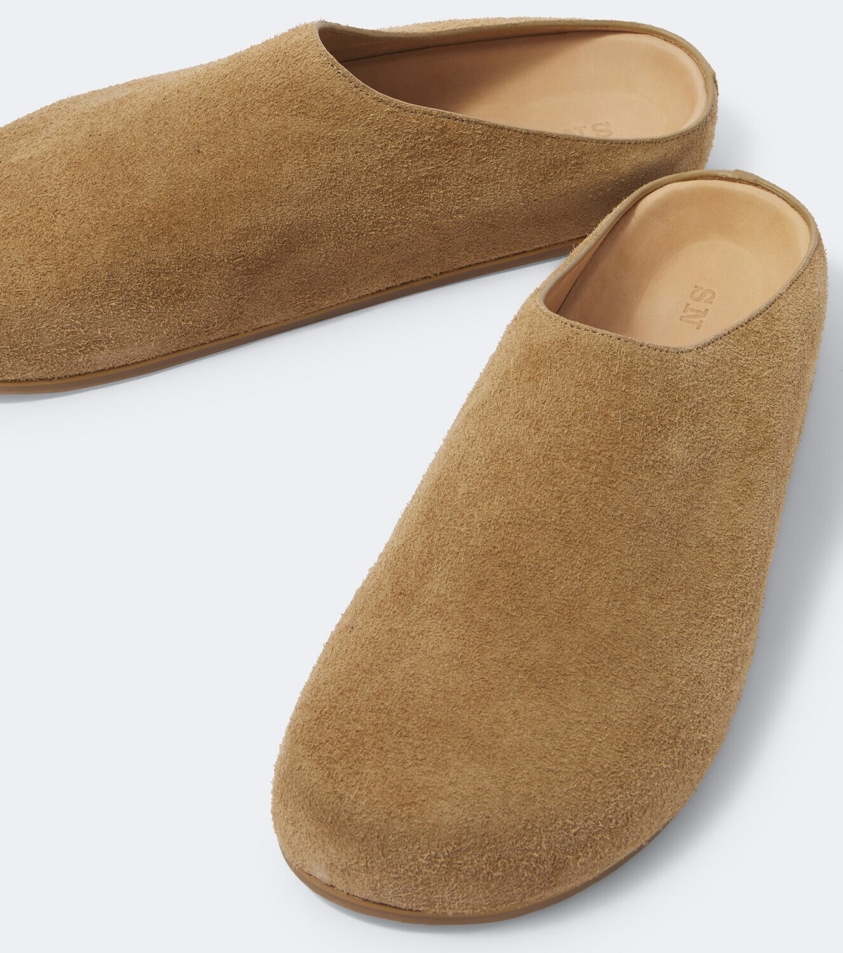 Studio Nicholson Wearing suede mules