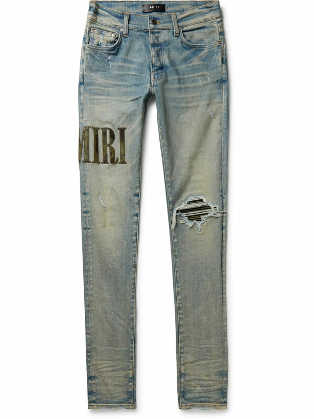 Photo: AMIRI - Skinny-Fit Leather-Trimmed Distressed Jeans - Blue