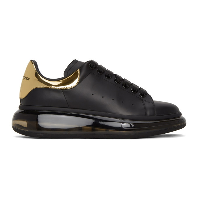 Photo: Alexander McQueen Black and Gold Clear Sole Oversized Sneakers