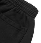 Vetements - Tapered Printed Fleece-Back Cotton-Jersey Sweatpants - Black