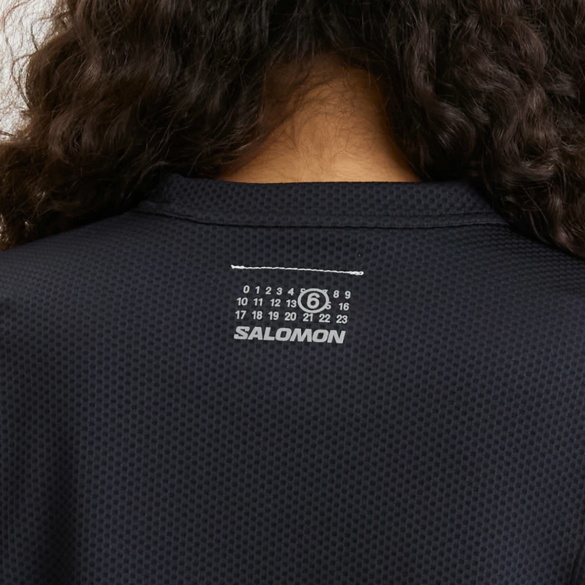 MM6 Maison Margiela Women's x Salomon Perforated Long Sleeve Sweater in Washed Black