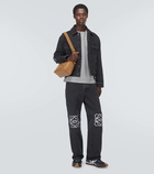 Loewe Anagram leather-trimmed straight jeans