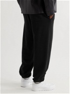 ACNE STUDIOS - Tapered Logo-Appliquéd Cotton-Jersey Sweatpants - Black